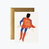 Super Dad superhero greeting card with a vibrant illustration of a man dressed as a superhero, featuring a red cape with "SUPER DAD" written on it, perfect for Father’s Day.