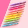 Vibrant colorful pens with inspirational quotes on a pink background, promoting positivity, motivation, and creative expression. Ideal for branding and promotional stationery from The Wraperie.