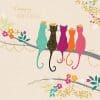 Brightly colored illustrated cats wearing crowns on a birthday greeting card, celebrating a special occasion with festive floral and leafy design elements.