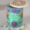 Yogurt container with colorful floral design and motivational message 