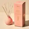 Aery Aztec Tubrose luxury reed diffuser with pink ceramic vase and natural reed sticks for home fragrance.