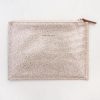 Shimmering rose gold glitter pouch with a zipper closure, stylish accessory for makeup or essentials. Perfect for adding a touch of sparkle to your daily routine or special occasions.