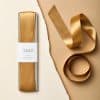 Recycled satin ribbon for gift wrapping and craft projects at The Wraperie, perfect for adding an elegant touch to any presentation. Quality, eco-friendly satin ribbons available in various sizes for creative uses.