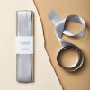 Shiny silver recycled satin ribbon for gift wrapping and craft projects, crafted by The Wraperie. Perfect for adding a sophisticated touch to present packaging or decorative designs.