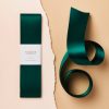 Wrapping paper with elegant teal design and white label, perfect for gift wrapping, luxury packaging, and special occasions.