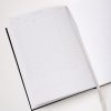 Blank daily planner or journal pages with sections for date, objectives, to-do lists, and time slots, ideal for organizing daily schedules.