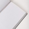 Blank planner or journal with lined pages for notes and scheduling.
