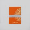Bright orange notebook with a white botanical illustration cover, featuring 40 blank pages, ideal for journaling or note-taking.