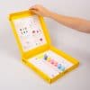 Vibrant paint set inside a yellow box with instructions for customizing designs, ideal for kids' creative activities. Suitable for arts & crafts, DIY projects, and colorful artistic fun.