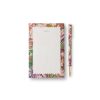 Vibrant floral patterned notepad and matching pen set from The Wraperie, perfect for stylish notes and journaling. Elegant design featuring pink, green, and gold accents.