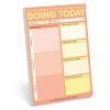 Neon-colored daily planner sheet with sections for tasks, mood, self-care, notes, food, and high/low points, ideal for organization and productivity—featured on The Wraperie website.