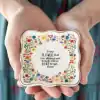 Colorful floral quote plate with inspirational message about growth and resilience at The Wraperie, showcasing vibrant design and meaningful sentiment.