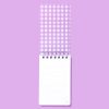Mini purple checkered spiral notepad with lined pages, perfect for note-taking and journaling, on a matching purple background.