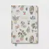 Vibrant illustrated notebook cover featuring colorful potted plants and the inspiring quote 