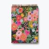 Colorful floral-themed notebook with gold spiral binding from The Wraperie, perfect for journaling, planning, or creative writing.