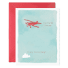 Adventures forever flying red airplane anniversary card with sky and cloud illustrations for travel lovers.