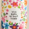 Celebration mug featuring colorful floral designs with the phrase 