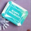 Happy Holidays gift box with geometric design, perfect for festive celebrations, themed for The Wraperie party and catering services, ideal for holiday gifting and event decor.