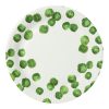 Fresh Brussels sprouts on a white disposable plate.