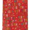 Festive Christmas gift bag with colorful holiday messages, gold stars, and cheerful decor, perfect for Christmas presents and holiday celebrations.