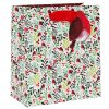 Joyful holiday gift bag with a festive red bird and berries pattern, perfect for Christmas presents, showcasing colorful botanical designs for seasonal gifting.