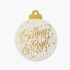 Shiny gold glitter holiday ornament with "Be Merry & Bright" message and star accents, ideal for Christmas decoration.