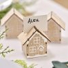 Small wooden house-shaped name card holders with the name 