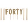 Gold candles and cake toppers spelling out "FORTY" for a 40th birthday celebration. Perfect for creating a stylish and festive milestone party decor. Ideal for birthdays, celebrations, and special events.