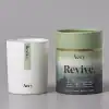 Revive Aery luxury soy candle in minimalist white and green packaging, designed to stimulate senses with cedar, amber, bergamot, tonka, lime, and woods, perfect for home relaxation.