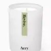 Revive scented candle featuring minimalist white design and motivational 
