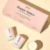 Aery Happy Space candle set in soft pink packaging, designed for mindfulness and relaxation, featuring three unique soy candles made in England.