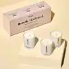 Heavily scented soy candles in personalized containers by The Wraperie for wellness and relaxation, featuring calming scents like Beach Spray, Lightly Musk, and Mala Muses. perfect for meditation and self-care routines.