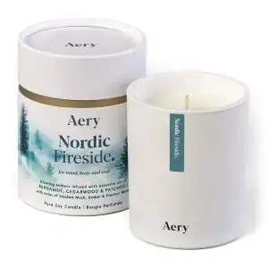 Aery Nordic Fireside scented candle with natural wood and essential oil infusion, creating a soothing atmosphere for mind, body, and soul. Perfect for home decor and relaxation.