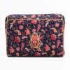 Vibrant floral fabric clutch purse with intricate beetle embroidery, perfect for fashionable accessories and statement pieces. Handcrafted design blends elegance and unique style, ideal for special occasions.