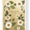 Delicate birthday card featuring white daisies with yellow centers and green leaves, set against a textured gold background, sending cheerful birthday wishes.