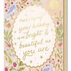 Bright birthday greeting card with floral and bird illustrations, perfect for celebrating special moments at The Wraperie.