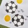 Soccer-themed paper plates with black and white hexagon pattern, perfect for sports parties, along with yellow drinks and mini soccer ball decorations on a white table.