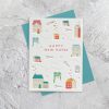 Colorful house-shaped die-cut design on a white "Happy New Home" greeting card, perfect for celebrating housewarming events, featuring charming illustrations of houses, keys, and greenery for a warm, welcoming feel.