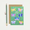 Colorful butterfly birthday greeting card with confetti and party hats, perfect for celebrating special occasions at The Wraperie. Bright, cheerful design ideal for birthday celebrations and gifting.