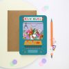Vibrant claw machine greeting card featuring playful animal and toy illustrations for The Wraperie. Perfect for quirky, fun gift cards and themed stationery collections.