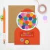 Bright handmade birthday card featuring a colorful gumball machine design with happy faces, vibrant 