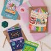Colorful space-themed birthday greetings with vibrant illustrations on cards, perfect for kids' celebrations and party invitations.