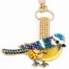 Colorful bird beaded keychain, handmade with rhinestones, beads, and embroidery, perfect for accessories or gifts, available at The Wraperie.