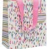 Colorful patterned gift bag with pink ribbon handles, ideal for wrapping presents and special occasions.