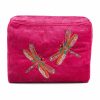 Vibrant pink velvet cosmetic bag with colorful embroidered dragonflies, perfect for organizing makeup and accessories.