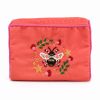 Colorful embroidered bee clutch bag with floral details, perfect for fashion-forward accessories and special occasions. Handcrafted and vibrant, ideal for style-conscious women.