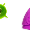 Green lint roller removal tool with handle for cleaning clothes and fabrics.