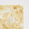 Elegant marbled gift bag with gold and cream swirls, perfect for packaging and presentation at The Wraperie. Handcrafted using eco-friendly, recycled paper for sustainable gifting.