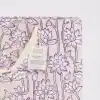 Vibrant pink block printed gift bag with purple floral designs, made from recycled cotton paper, perfect for eco-friendly gift wrapping and sustainable packaging.