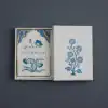 Deluxe floral stationery set by The Wraperie, featuring elegant blue and gold botanical designs in a gift box, perfect for luxury paper products and special occasions.